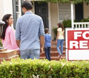 Hispanic family outside home for rent