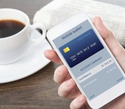 businesswoman hand holding a phone with mobile wallet online shopping